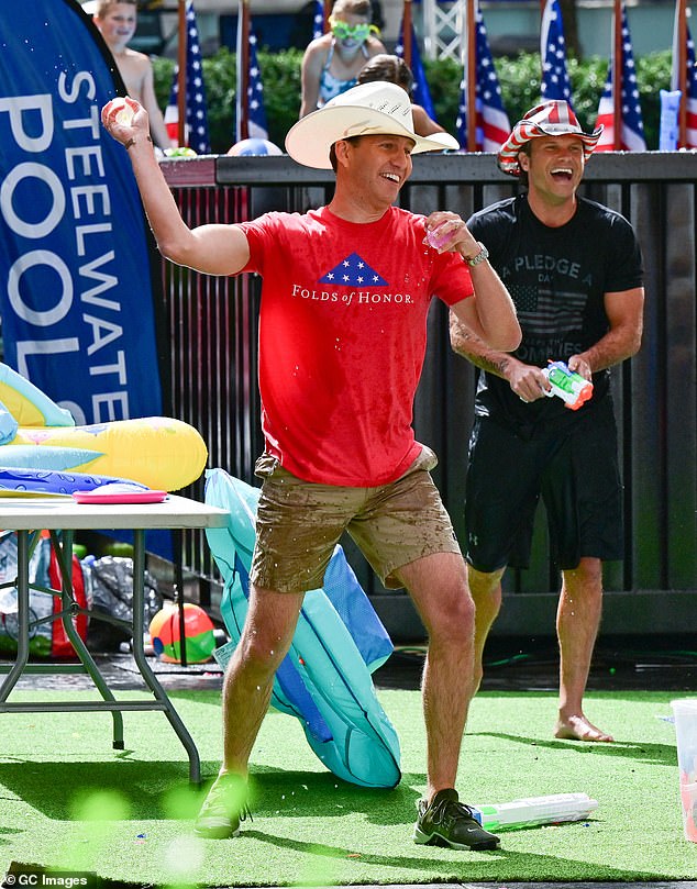 Hegseth (right) and Cain are seen during a Fox & Friends Weekend segment in 2021