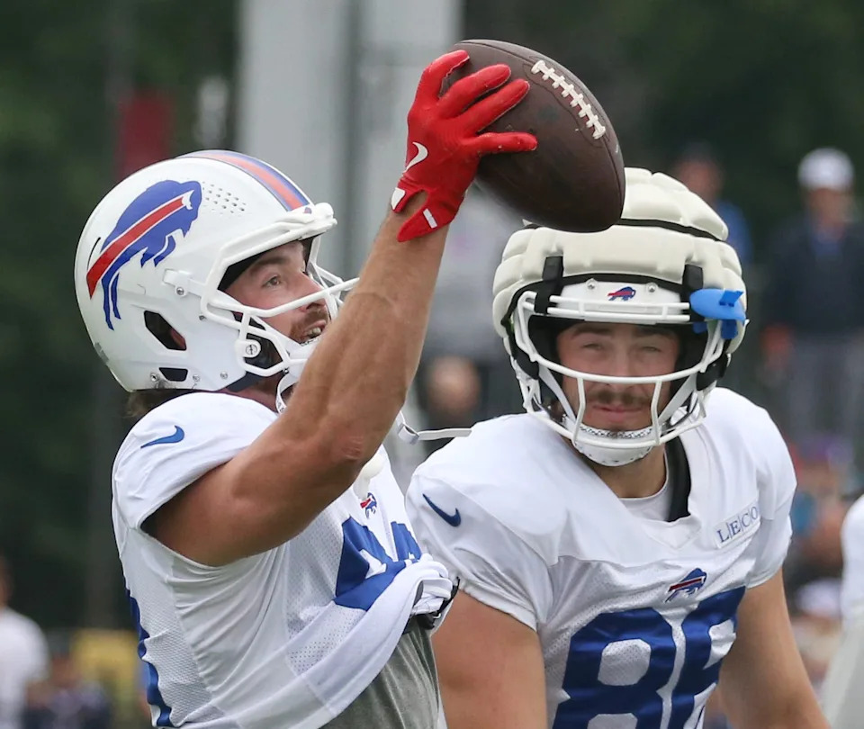 Bills tight end Dawson Knox eyes in a one-handed catch over Dalton Kincaid during position drills during day seven of Buffalo Bills training camp at St. John Fisher University Thursday, July 31, 2025 in Pittsford, NY. This was the first day Knox took part in camp with full pads on.