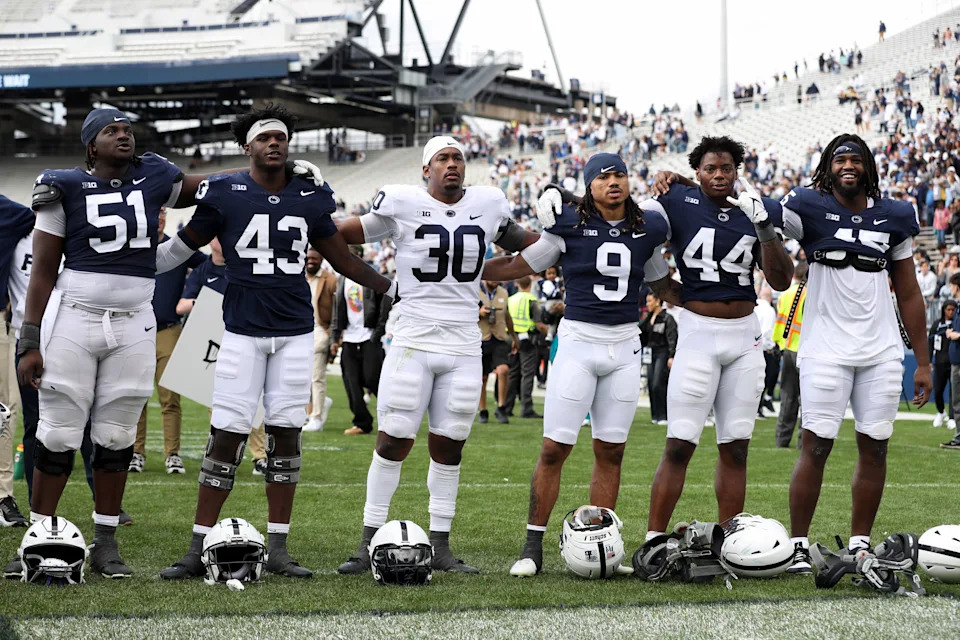 Apr 26, 2025; University Park, PA, USA; The Penn State Nittany Lion players sing their alma mater following the Blue White spring game at Beaver Stadium. The White team defeated the Blue team 10-8. Mandatory Credit: Matthew O'Haren-Imagn Images