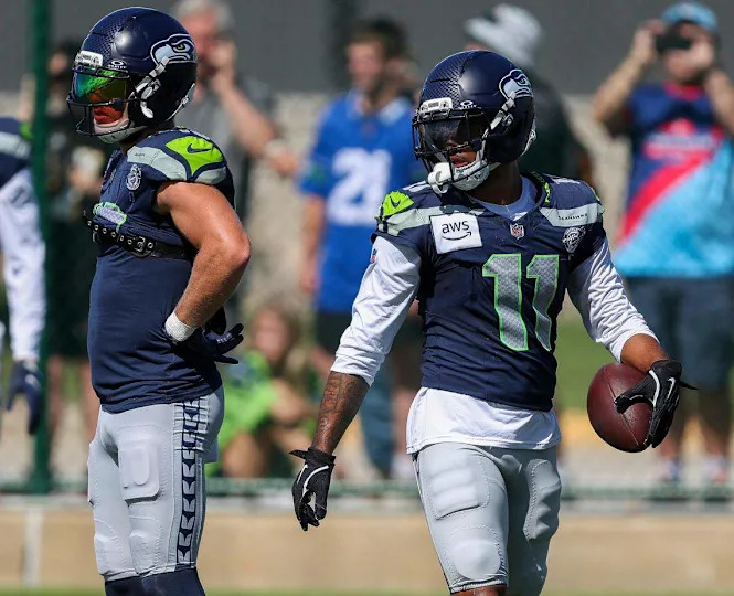 Seattle Seahawks wide receivers Cooper Kupp (10) and Jaxon Smith-Njigba (11) wait for their next drill reps during a joint practice with the Green Bay Packers on Thursday, August 21, 2025, at Clarke Hinkle Field in Ashwaubenon, Wis. Tork Mason/USA TODAY NETWORK-Wisconsin Tork Mason/USA TODAY NETWORK