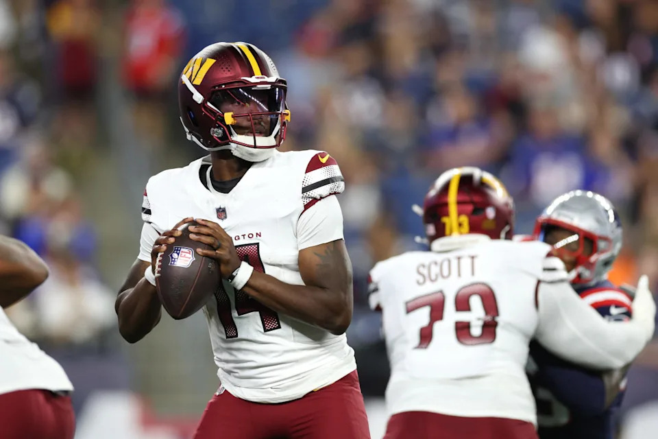 Aug 8, 2025; Foxborough, Massachusetts, USA; Washington Commanders quarterback Josh Johnson (14) drops back to pass during the first half against the New England Patriots at Gillette Stadium. Mandatory Credit: Paul Rutherford-Imagn Images© Paul Rutherford-Imagn Images