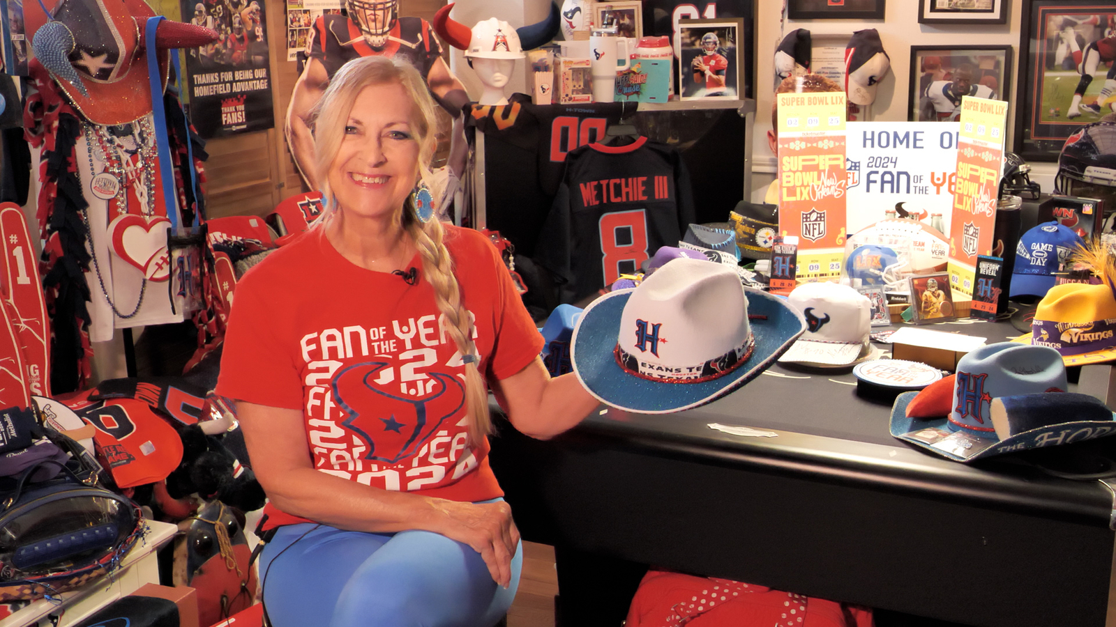 The Texans fan behind head-turning hats