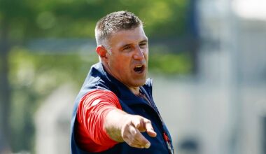 Patriots coach leaps into pile of players to defuse training camp skirmish