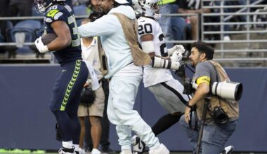 Seattle Seahawks running back George Holani (36) bounces off former Seahawks running back Marshawn Lynch after scoring a touchdown during the first quarter of the game against the Las Vegas Raiders at Lumen Field, on Thursday, Aug. 7, 2025, in Seattle, Wash. Brian Hayes/bhayes@thenewstribune.com