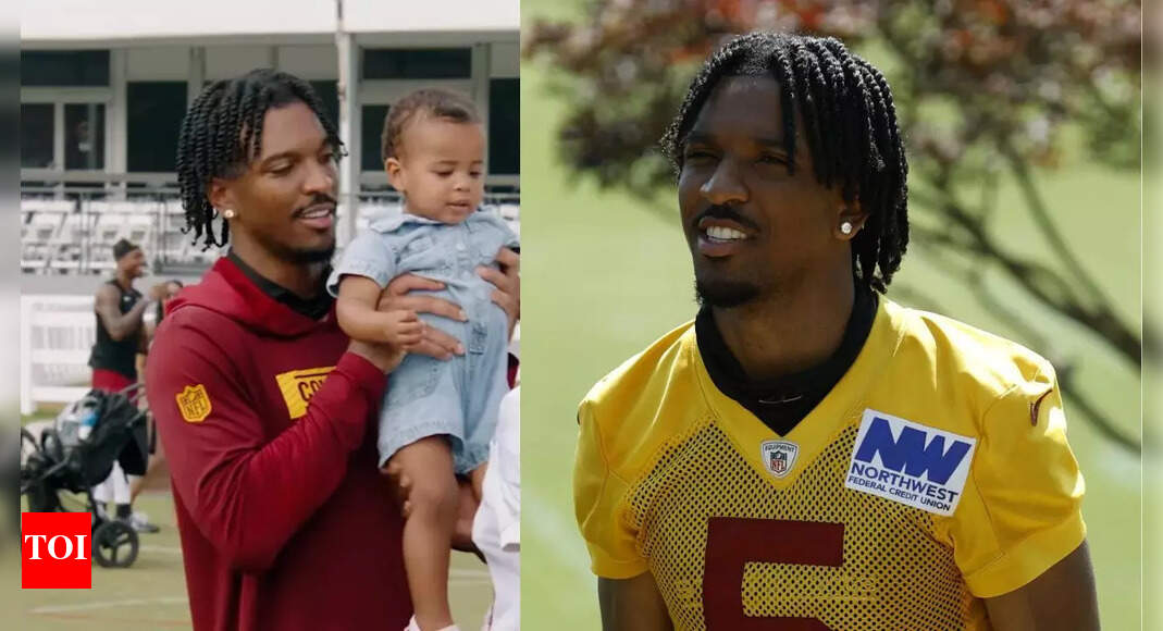 Jayden Daniels hilariously struggles to hold baby during Commanders practice in must-see viral moment | NFL News
