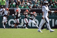 Cleveland Browns defensive end KJ Henry (52) celebrates after scoring a touchdown during an...