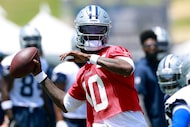 Dallas Cowboys quarterback Joe Milton (10) fires a pass under pressure during the first day...