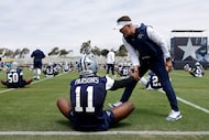 Dallas Cowboys defensive end Micah Parsons (11) is greeted by head coach Brian...