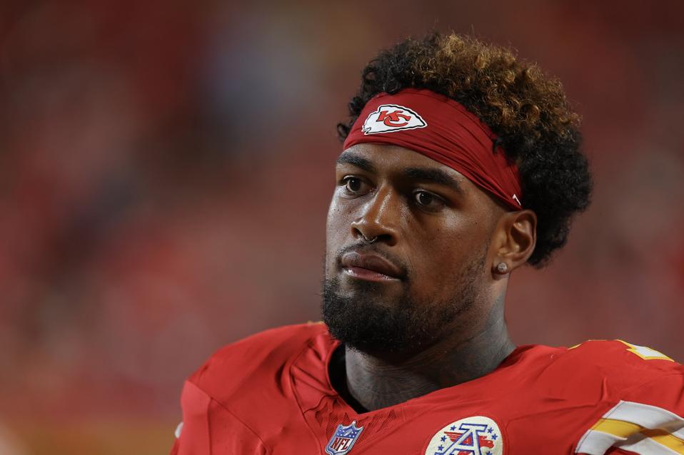 Chiefs rookie offensive lineman Josh Simmons looks on.