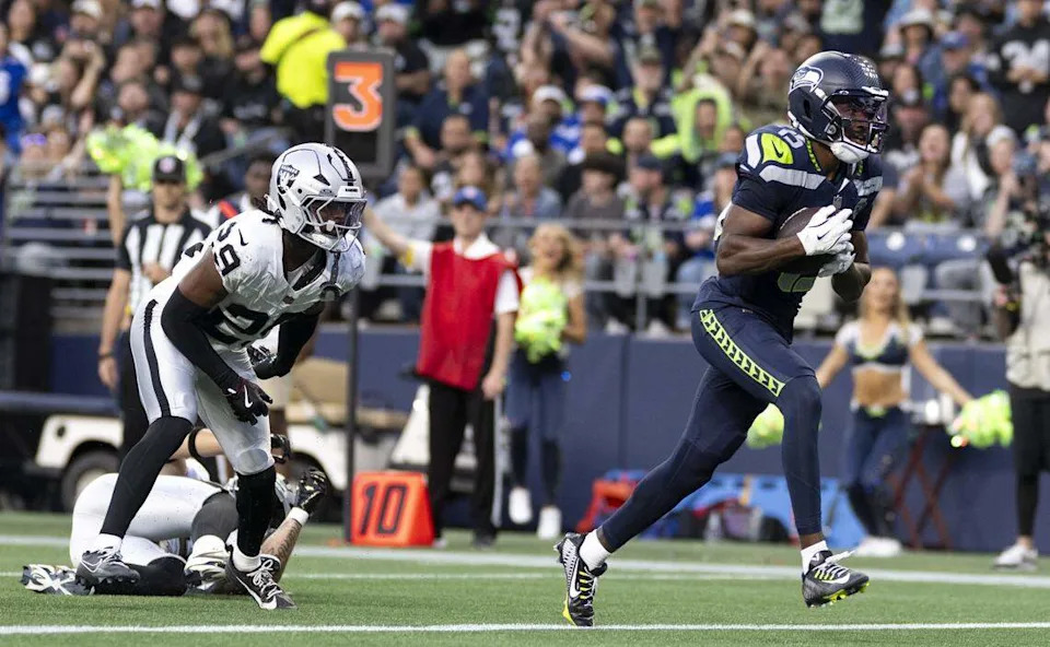 Seattle Seahawks wide receiver Tory Horton (15) scores a touchdown during the second quarter of the game against the Las Vegas Raiders at Lumen Field, on Thursday, Aug. 7, 2025, in Seattle.