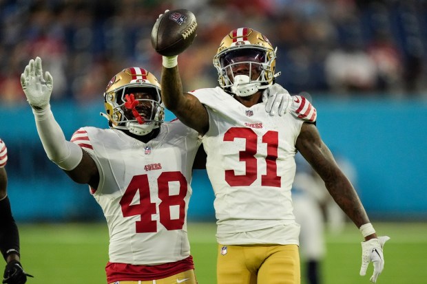 San Francisco 49ers cornerback Renardo Green (31) celebrates with linebacker Tatum Bethune (48) after recovering a fumble during the second half of an NFL preseason football game against the Tennessee Titans, Saturday, Aug. 10, 2024, in Nashville, Tenn. (AP Photo/Mike Stewart)