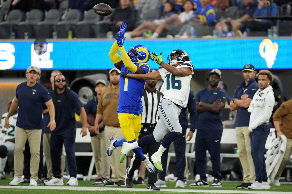 Los Angeles Rams cornerback Derion Kendrick (1) intercepts a pass by the Seahawks&#x002019; Geno Smith intended for Seattle wide receiver Tyler Lockett (16) in the fourth quarter of an NFL game SoFi Stadium in Inglewood, California, Nov. 19, 2023.