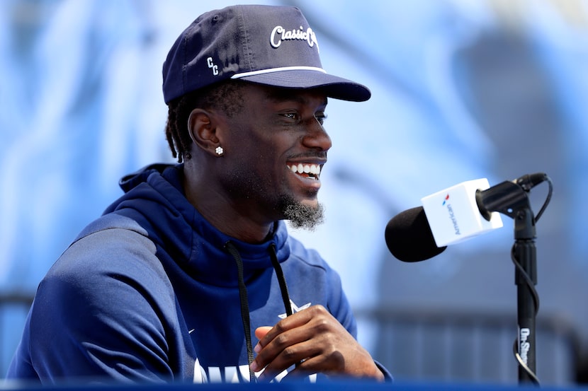 Dallas Cowboys wide receiver George Pickens (3) and cornerback Kaiir Elam (20) answer...