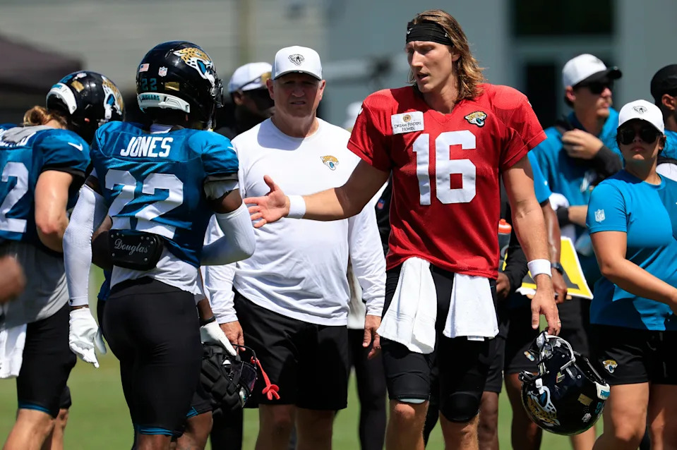 Jacksonville Jaguars quarterback Trevor Lawrence (16) greets cornerback Jarrian Jones (22) congratulating him on his final defensive play of the 12th period after an NFL training camp session at the Miller Electric Center, Thursday, Aug. 14, 2025 in Jacksonville, Fla.