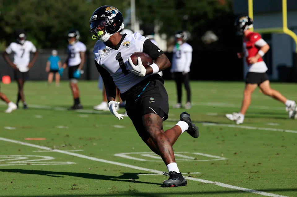 Jacksonville Jaguars running back Travis Etienne Jr. (1) runs the ball during an NFL training camp session at the Miller Electric Center, Monday, Aug. 11, 2025 in Jacksonville, Fla. [Corey Perrine/Florida Times-Union]