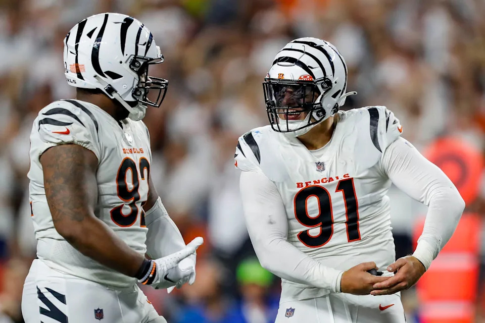 Sep 25, 2023; Cincinnati, Ohio, USA; Cincinnati Bengals defensive end Trey Hendrickson (91) reacts after a play with defensive tackle BJ Hill (92) in the second half against the Los Angeles Rams at Paycor Stadium. Mandatory Credit: Katie Stratman-USA TODAY Sports