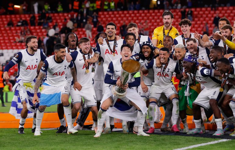 Tottenham Hotspur's Son Heung-min lifts the trophy with teammates after winning the Europa League Final 