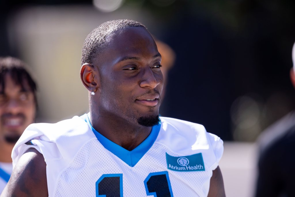 Carolina Panthers rookie linebacker Nic Scourton (11) walks to the field for Panthers Training Camp.