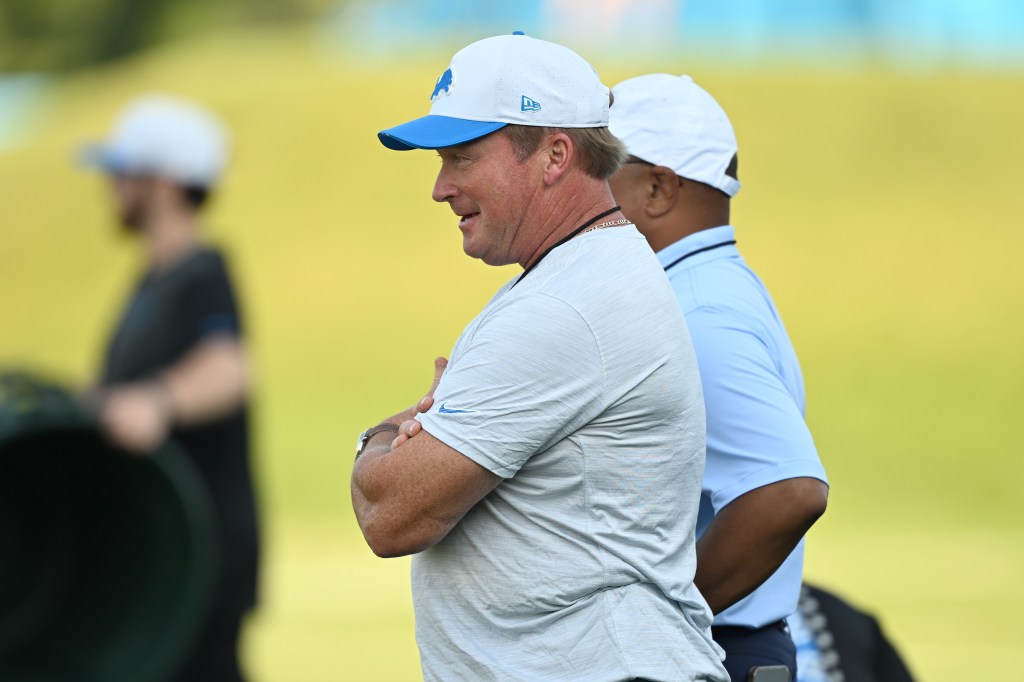 NBC analyst Jon Gruden watches the Detroit Lions training camp with former Monday Night Football and current NBC announcer Mike Tirico at Meijer Performance Center.