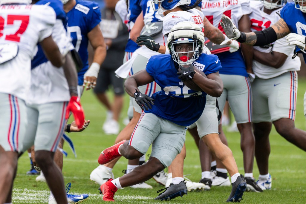 Giants running back Devin Singletary (26) runs with the ball during training camp at the Quest Diagnostics center, Friday, Aug. 1, 2025, in East Rutherford, New Jersey. 