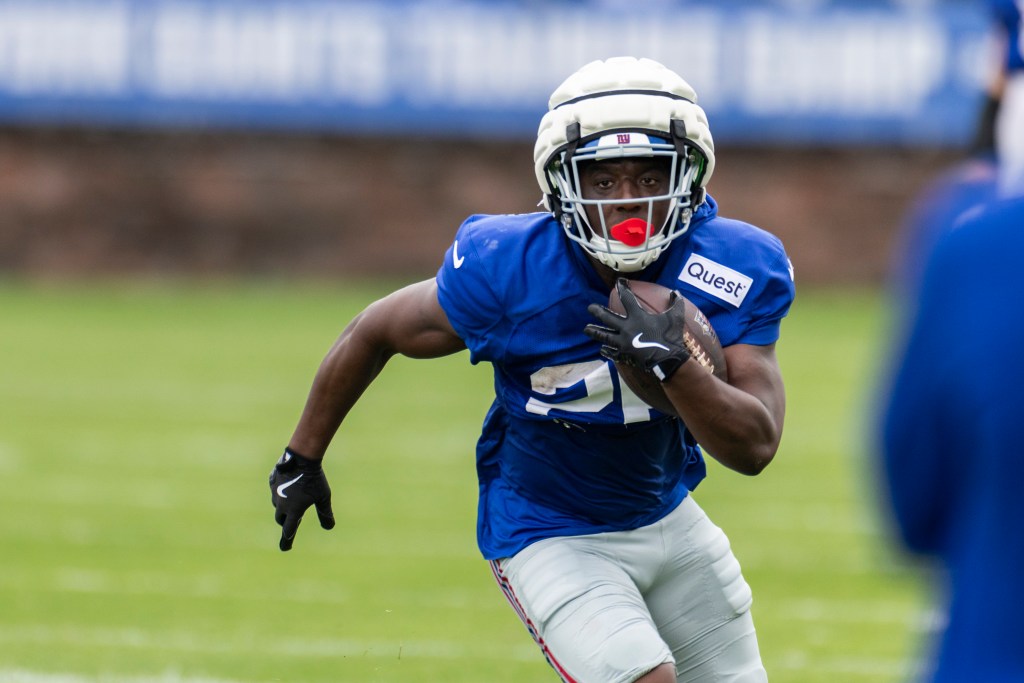 New York Giants running back Devin Singletary (26) runs with the ball during training camp.