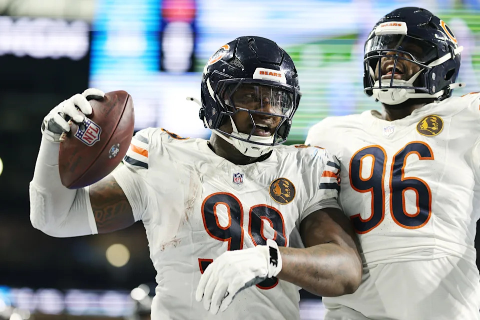 DETROIT, MICHIGAN - NOVEMBER 28: Gervon Dexter Sr. #99 and Zacch Pickens #96 celebrate after a fumble recovery during the second quarter against the Detroit Lions of the Chicago Bears at Ford Field on November 28, 2024 in Detroit, Michigan. (Photo by Mike Mulholland/Getty Images)