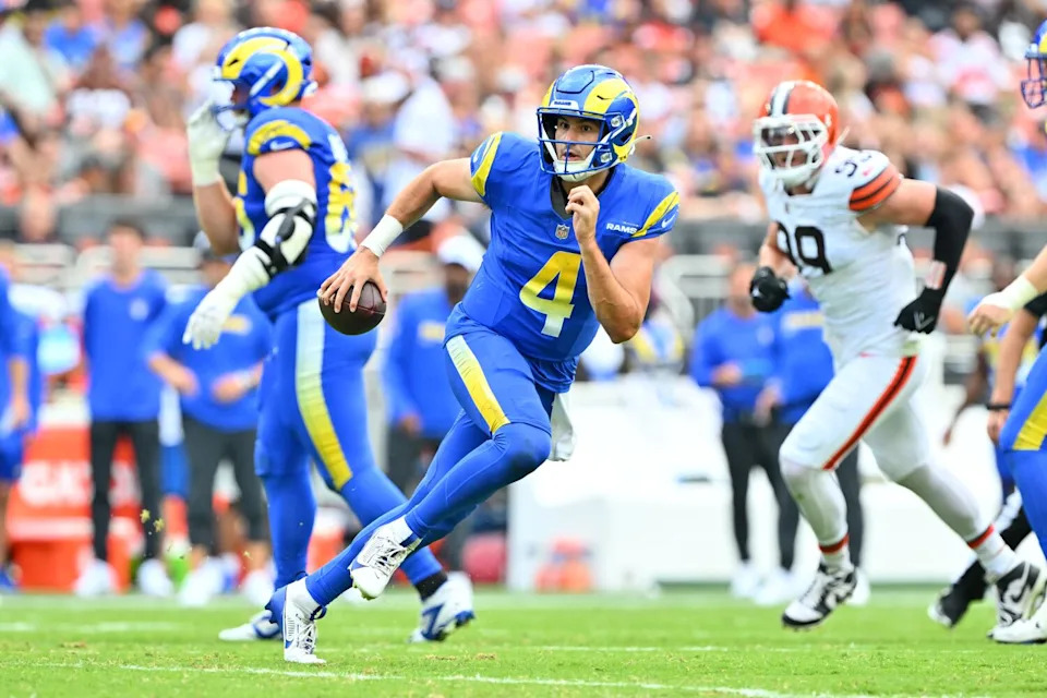 Rams quarterback Dresser Winn scrambles against the Cleveland Browns in the second quarter Saturday.