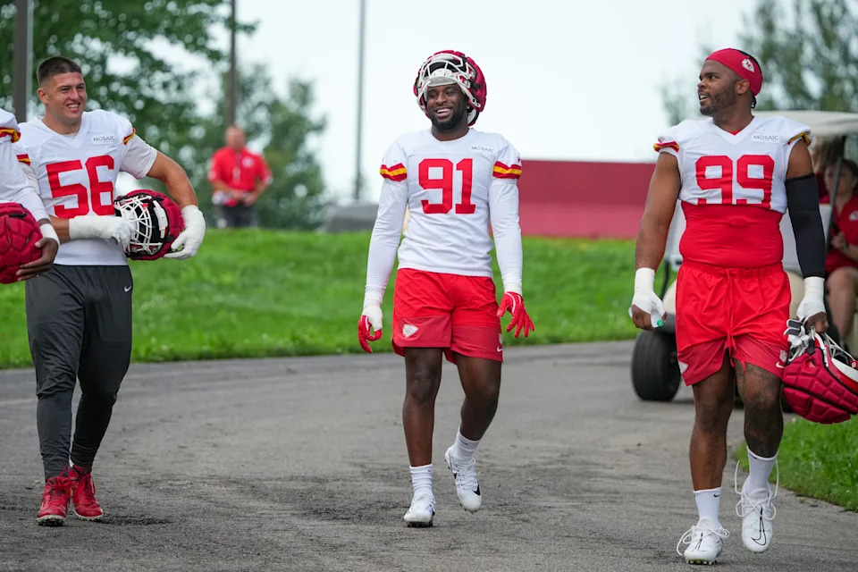 Jul 22, 2025; St. Joseph, MO, USA; Kansas City Chiefs defensive end George Karlaftis (56) and defensive end Felix Anudike-Uzomah (91) and defensive tackle Jerry Tillery (99) walk down the hill to the practice fields during training camp at Missouri Western State University. Mandatory Credit: Denny Medley-Imagn Images