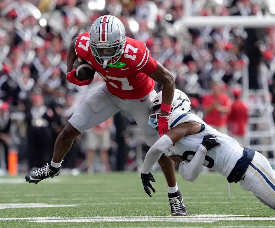 August 31, 2024; Columbus, Ohio, USA;
Ohio State Buckeyes wide receiver Carnell Tate (17) slips away from Akron Zips cornerback Devonte Golden-Nelson (3) during the first half of Saturday’s NCAA Division I football game at Ohio Stadium.