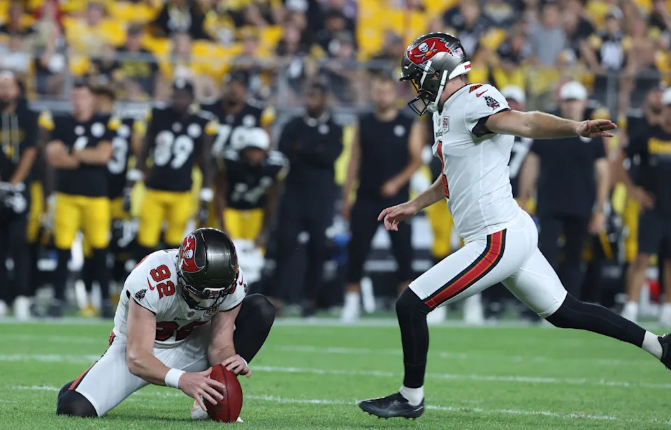 Aug 16, 2025; Pittsburgh, Pennsylvania, USA; Tampa Bay Buccaneers place kicker Chase McLaughlin (right) kicks the game winning g field goal from the hold of punter Riley Dixon (92) as time expires to defeat the Pittsburgh Steelers at Acrisure Stadium. Mandatory Credit: Charles LeClaire-Imagn Images
