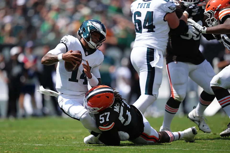 Aug 16, 2025; Philadelphia, Pennsylvania, USA; Cleveland Browns defensive lineman Isaiah McGuire (57) sacks Philadelphia Eagles quarterback Dorian Thompson-Robinson (14) in the first half at Lincoln Financial Field. Mandatory Credit: Kyle Ross-Imagn Images