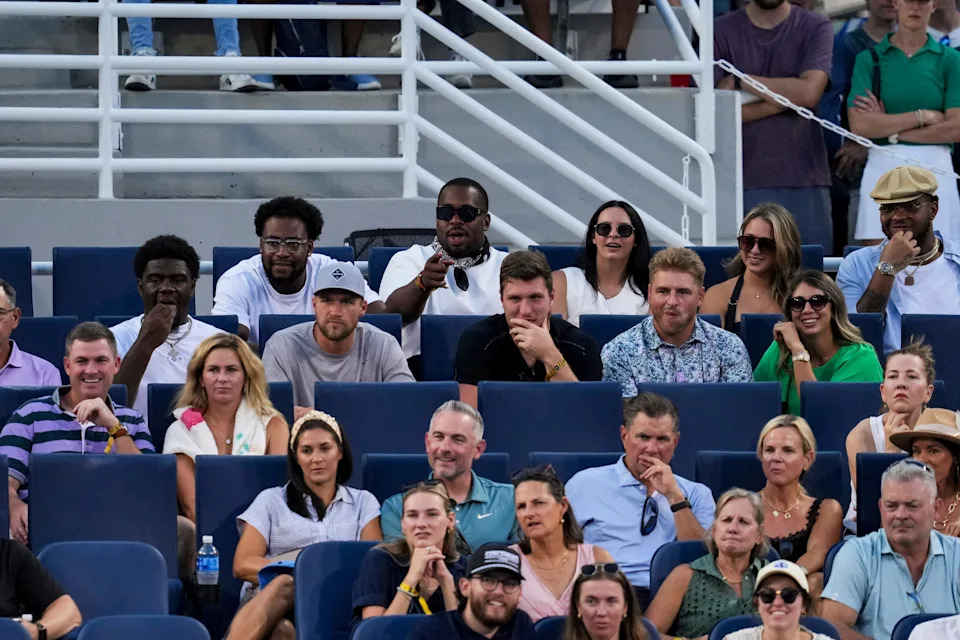 Aug 11, 2025; Cincinnati, OH, USA; Members of the Cincinnati Bengals watch action on the P&G Center Court during the Cincinnati Open at the Lindner Family Tennis Center.