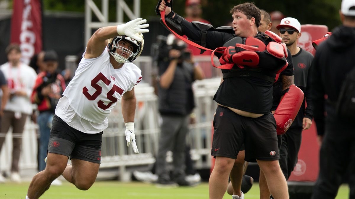 San Francisco 49ers linebacker Chazz Surratt (55) swats at a ball during a pass rushing drill on the second day of training camp.