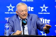 Dallas Cowboys owner Jerry Jones responds to a reporter's question during an NFL football...