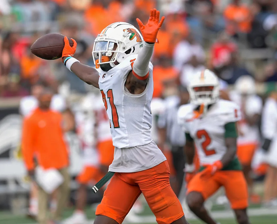 Florida A&M defensive back T.J. Huggins (21) c elebrates an interception against Alabama State during their game on the ASU campus in Montgomery, Ala., on Saturday October 5, 2024.