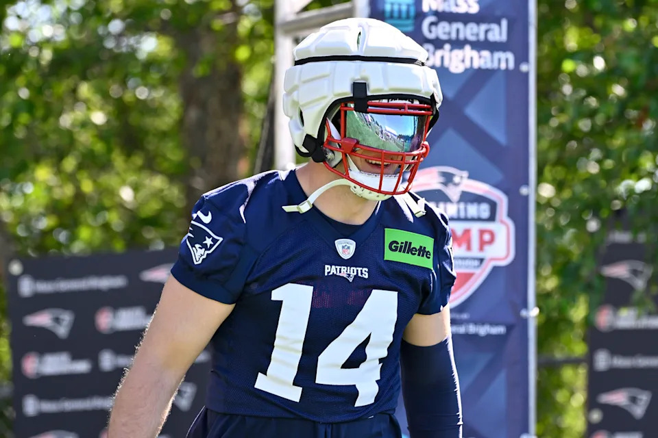 Jul 23, 2025; Foxborough, MA, USA; New England Patriots linebacker Robert Spillane (14) walks to the practice fields for training camp at Gillette Stadium. Mandatory Credit: Eric Canha-Imagn Images
