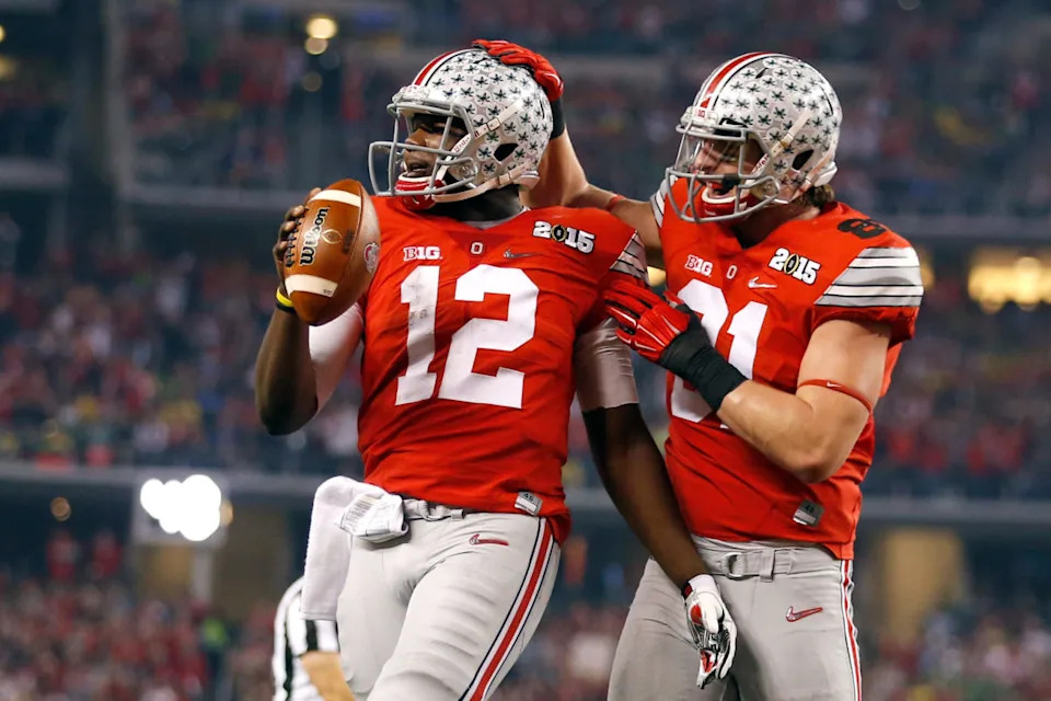 ARLINGTON, TX - JANUARY 12: Quarterback Cardale Jones #12 of the Ohio State Buckeyes celebrates after scoring a one yard touchdown in the second quarter against the Oregon Ducks during the College Football Playoff National Championship Game at AT&T Stadium on January 12, 2015 in Arlington, Texas. (Photo by Christian Petersen/Getty Images)