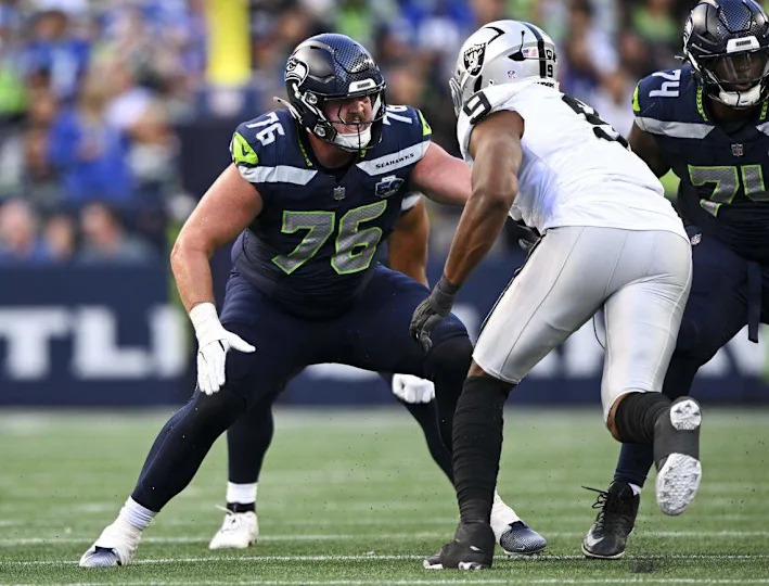 Seattle Seahawks guard Grey Zabel (76) blocks Las Vegas Raiders defensive end Tyree Wilson (9) during the first quarter of the game at Lumen Field, on Thursday, Aug. 7, 2025, in Seattle, Wash.