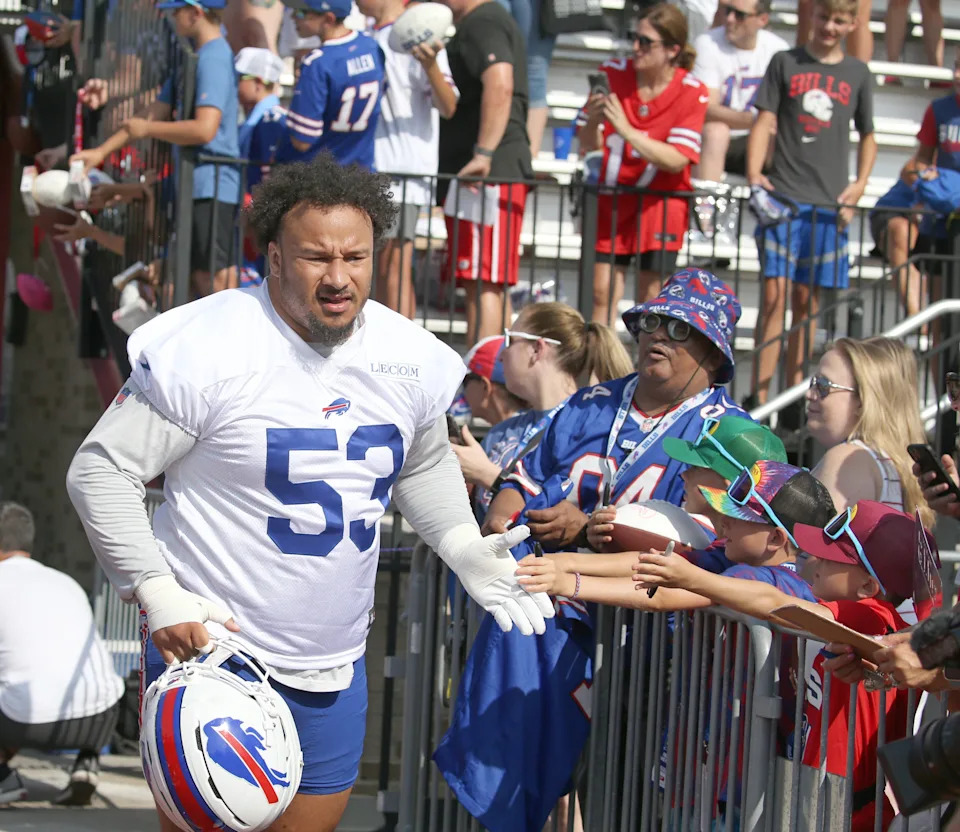 Bills offensive lineman Kendrick Green high-fives fans as the takes the field during the second day of Buffalo Bills training camp at St. John Fisher University Thursday, July 24, 2025 in Pittsford.