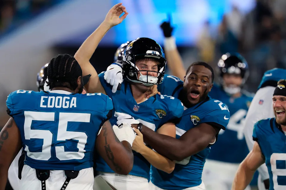 Jacksonville Jaguars place kicker Cam Little (39) is celebrated for his 70-yard field goal by safety Daniel Thomas (20), right, and others during the second quarter of an NFL preseason matchup at EverBank Stadium, Saturday, Aug. 9, 2025 in Jacksonville, Fla. [Corey Perrine/Florida Times-Union]
