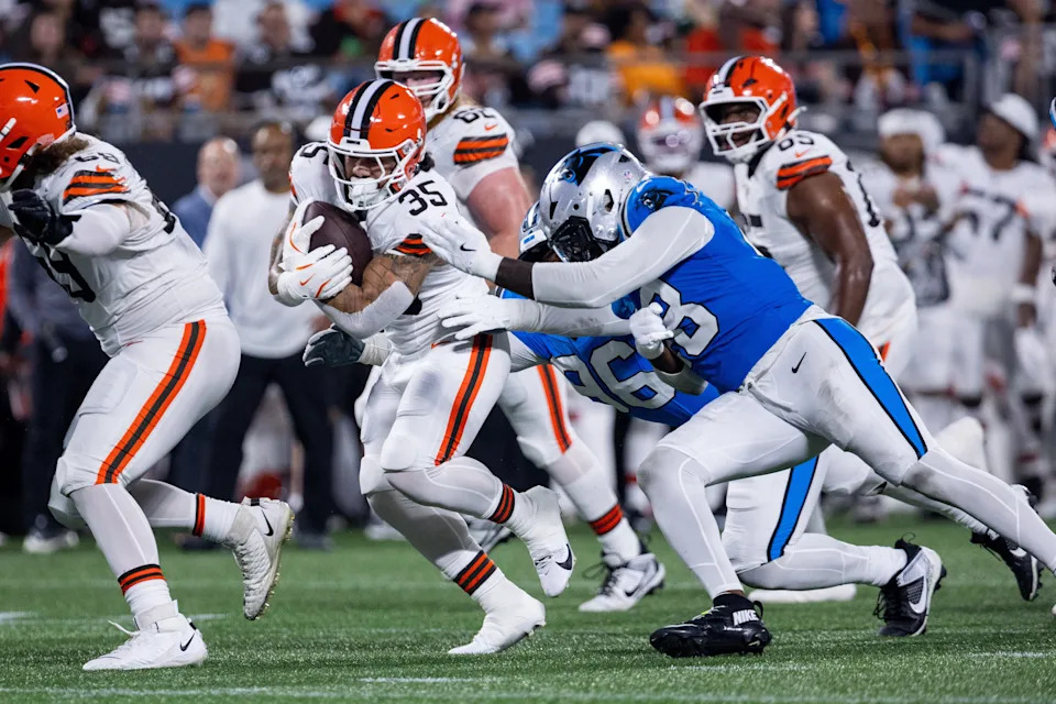 Aug 8, 2025; Charlotte, North Carolina, USA; Cleveland Browns running back Toa Taua (35) runs the ball against Carolina Panthers linebacker Thomas Incoom (48) during the fourth quarter at Bank of America Stadium. Mandatory Credit: Scott Kinser-The USAToday Network via Imagn Images