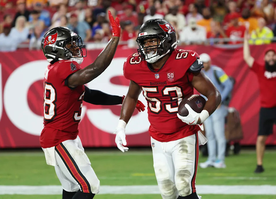 Aug 9, 2025; Tampa, Florida, USA; Tampa Bay Buccaneers linebacker Nick Jackson (53) is congratulated after he intercepted the ball while Tampa Bay Buccaneers safety Rashad Wisdom (38) celebrates against the Tennessee Titans during the second half at Raymond James Stadium. Mandatory Credit: Kim Klement Neitzel-Imagn Images