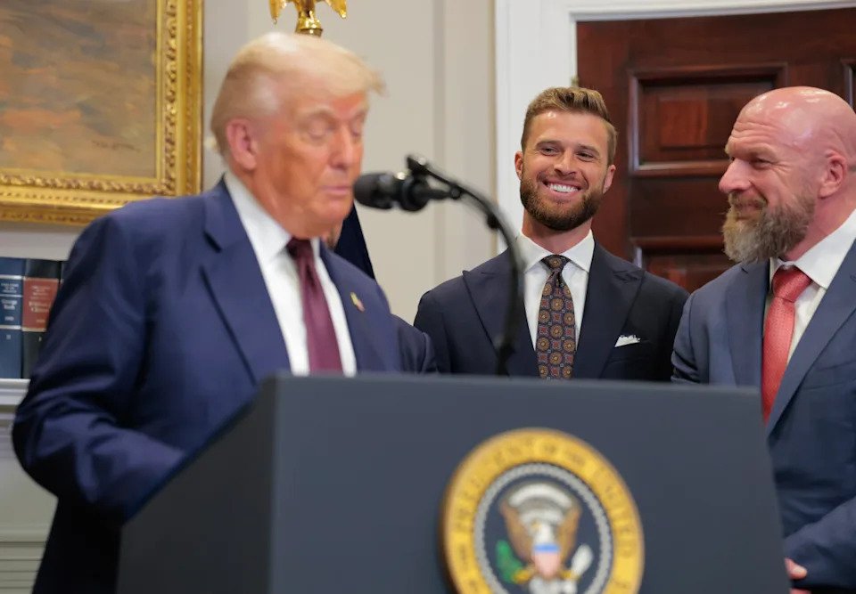 WASHINGTON, DC - JULY 31: Kansas City Chiefs kicker Harrison Butker (C) and WWE Chief Creative Officer Paul “Triple H” Levesque (R) look on as U.S. President Donald Trump speaks during an executive order signing ceremony in the Roosevelt Room of the White House on July 31, 2025 in Washington, DC. Trump signed a series of orders that will expand on his council on sports, fitness and nutrition, including by reviving the Presidential Fitness Test in public schools. (Photo by Anna Moneymaker/Getty Images)Anna Moneymaker/Getty Images