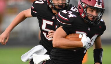 Huskies drop gridiron opener against Titans