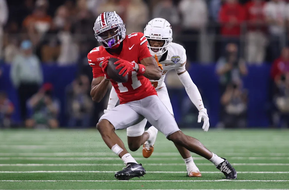 Ohio State wide receiver Carnell Tate (17) makes a catch against Texas during their College Football Playoff semifinal in the Cotton Bowl at AT&T Stadium.