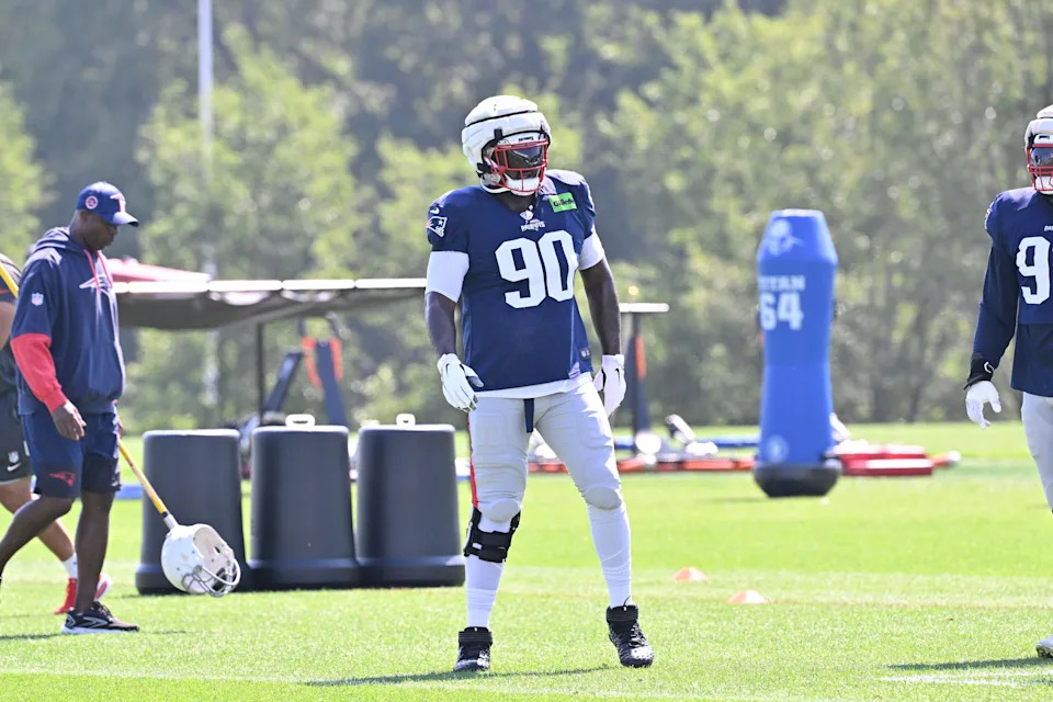 Jul 28, 2025; Foxborough, MA, USA; New England Patriots defensive tackle Christian Barmore (90) gets warmed up during training camp at Gillette Stadium. Mandatory Credit: Eric Canha-Imagn Images