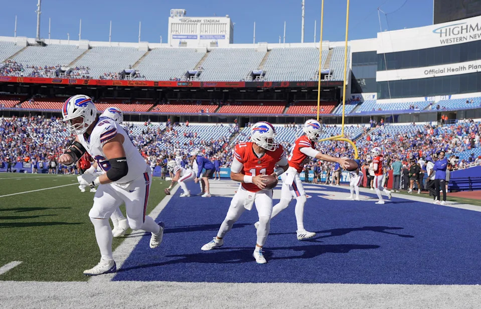 Buffalo Bills quarterbacks Mitchell Trubisky and Mike White turn and make a hand off during the Return of the Blue & Red practice at Highmark Stadium in Orchard Park on Aug.1, 2025.