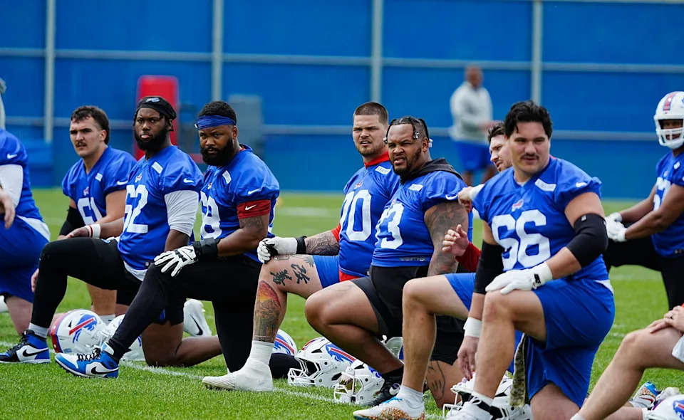 Buffalo Bills Jacob Bayer, Sedrick Van-Pran-Granger, Tylan Grable, Alec Anderson, Dion Dawkins and Connor McGovern line up and stretch during their voluntary workout at their practice facility on May 27, 2025.