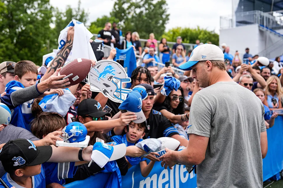Detroit Lions quarterback Jared Goff (16) signs autographs for fans after practice at training camp at Meijer Performance Center in Allen Park on Thursday, August 21, 2025.