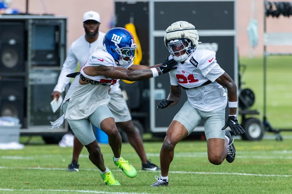 Giants cornerback Dru Phillips (22) runs against cornerback Paulson Adebo (21) during training camp. Corey Sipkin for the NY POST
